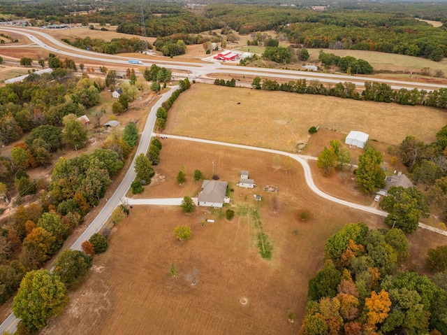 birds eye view of property with a rural view