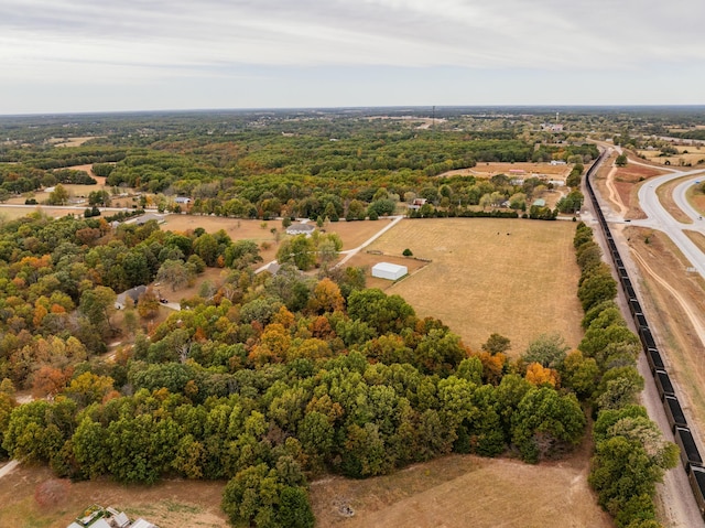 drone / aerial view featuring a forest view