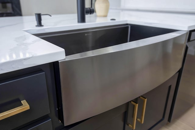 room details featuring light countertops and a sink