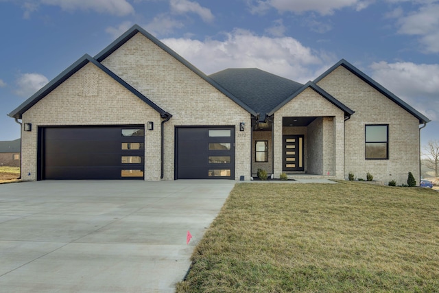 view of front facade with concrete driveway, an attached garage, brick siding, and a front lawn