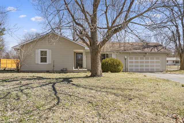 ranch-style house featuring a garage, crawl space, driveway, and fence