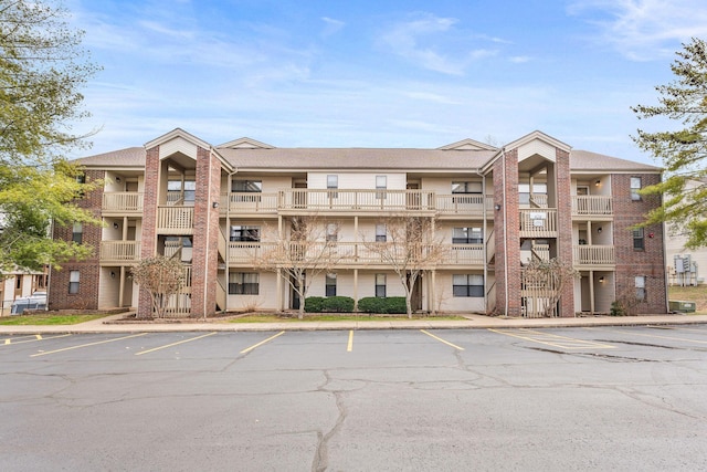 view of property with uncovered parking