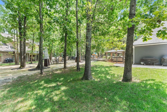 view of yard with a gazebo, a patio, and fence