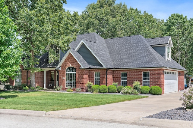 view of front of home featuring brick siding, concrete driveway, roof with shingles, an attached garage, and a front yard