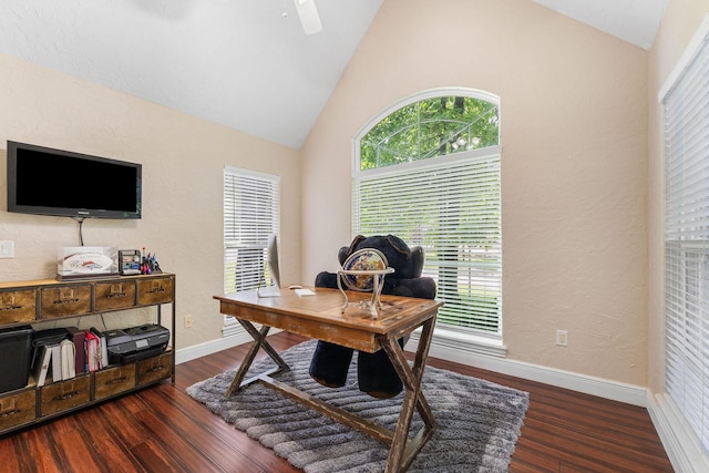 office area with high vaulted ceiling, plenty of natural light, wood finished floors, and baseboards