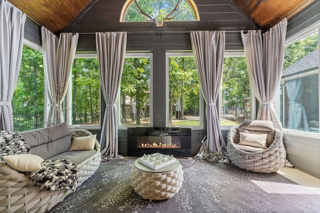 sunroom featuring wooden ceiling and vaulted ceiling