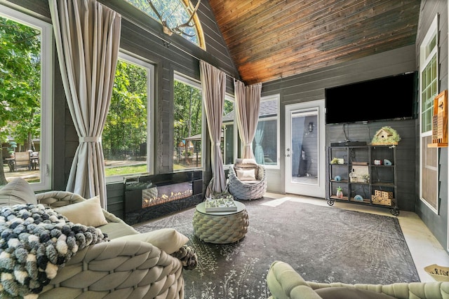 sunroom with lofted ceiling and wooden ceiling