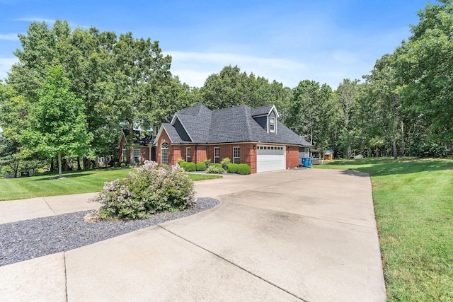 view of front of house with concrete driveway, brick siding, an attached garage, and a front lawn