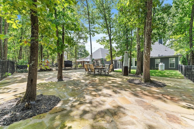 view of patio featuring a fenced backyard and outdoor dining area