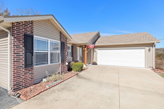 ranch-style house featuring a garage, brick siding, driveway, and roof with shingles