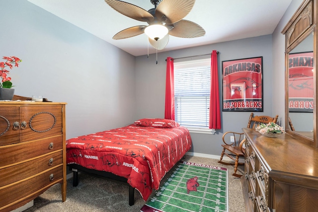 carpeted bedroom featuring ceiling fan and baseboards