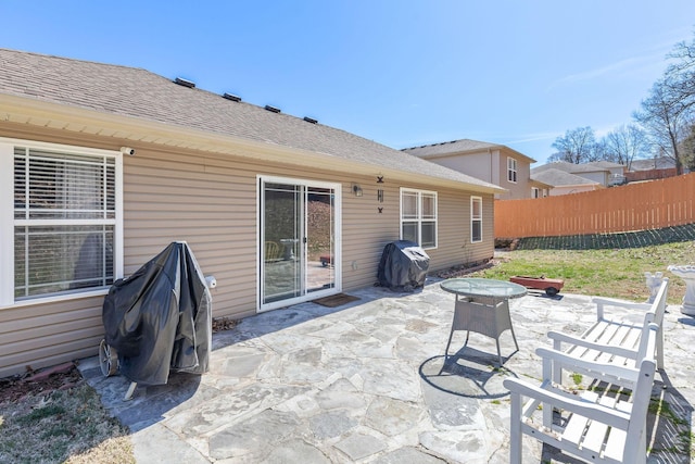 view of patio / terrace featuring area for grilling and fence