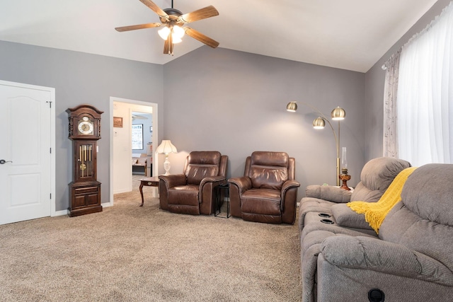 carpeted cinema room with lofted ceiling, baseboards, and a ceiling fan