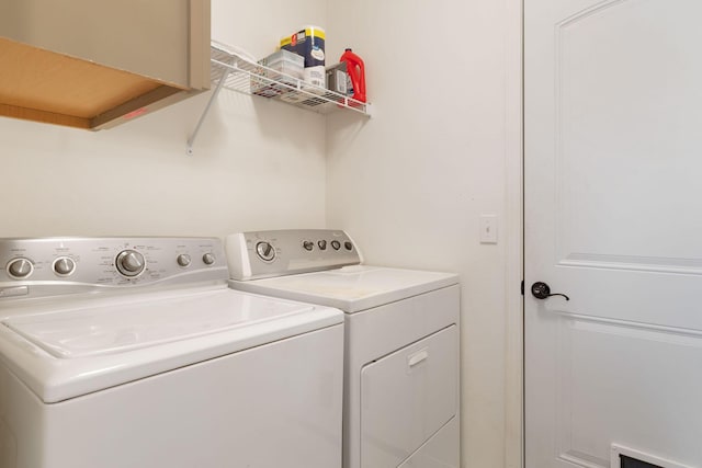 washroom featuring laundry area and independent washer and dryer