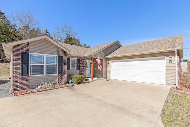 ranch-style house featuring a garage, driveway, brick siding, and roof with shingles