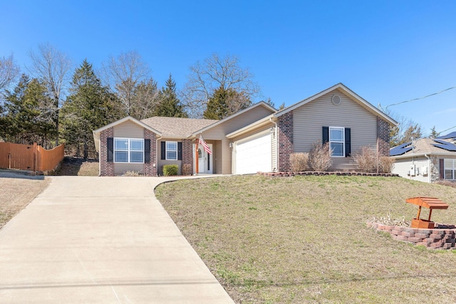 ranch-style house with brick siding, fence, a garage, driveway, and a front lawn