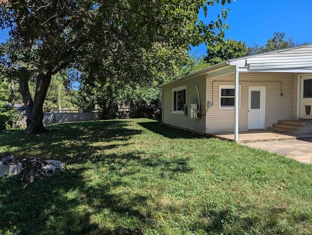 view of yard featuring fence and a patio