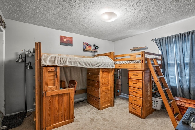 bedroom with a textured ceiling and carpet floors