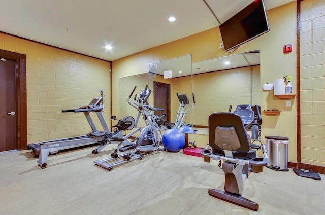 exercise room with carpet and recessed lighting