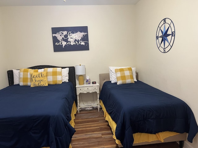 bedroom with wood finished floors