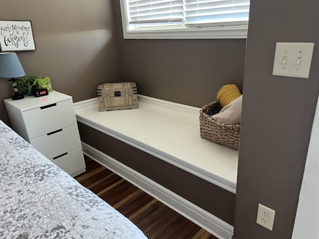 bedroom featuring dark wood finished floors