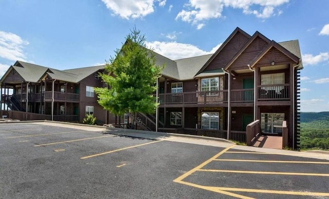 view of property featuring uncovered parking