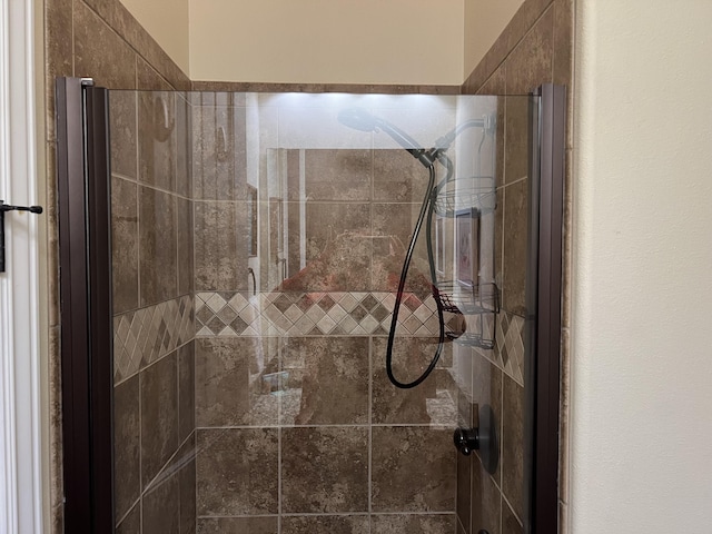 bathroom featuring a shower stall