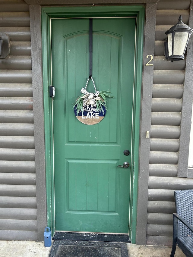 entrance to property with log veneer siding