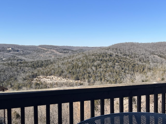 view of mountain feature with a forest view