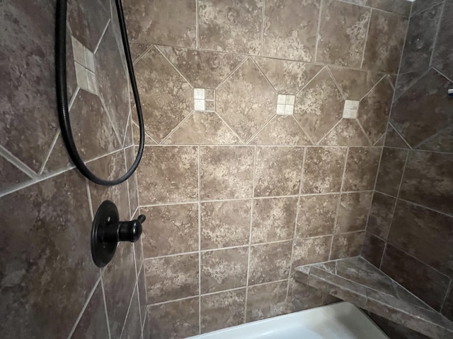 bathroom featuring tiled shower