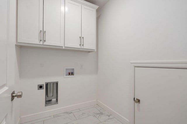 laundry area with marble finish floor, hookup for a washing machine, cabinet space, hookup for an electric dryer, and baseboards