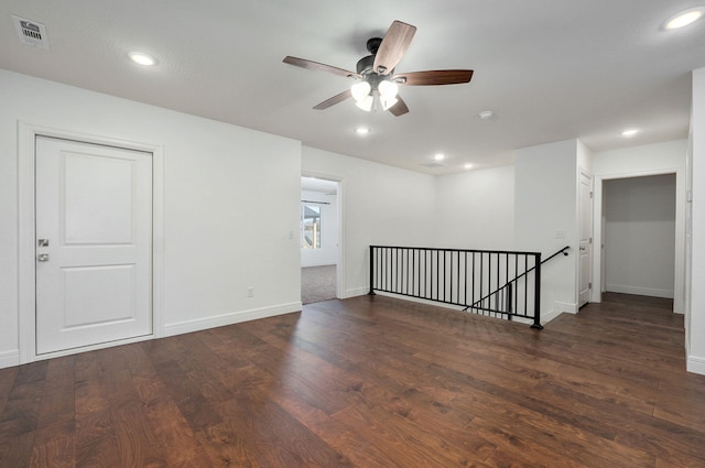 unfurnished room with ceiling fan, recessed lighting, wood finished floors, visible vents, and baseboards