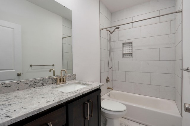 bathroom featuring toilet, shower / bathtub combination, and vanity