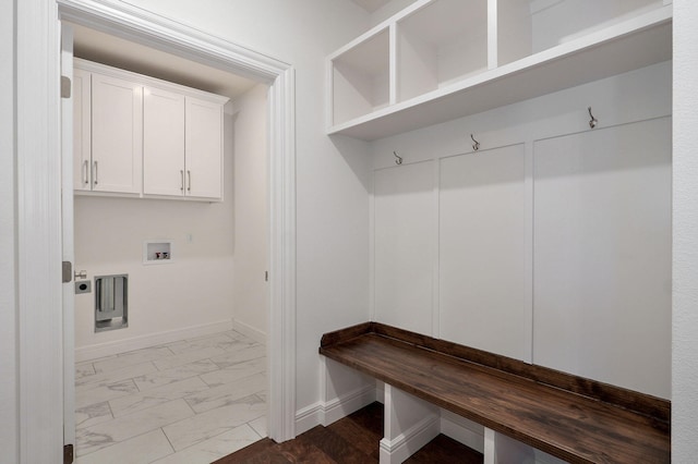 mudroom featuring marble finish floor and baseboards