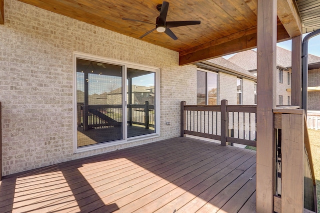 wooden deck featuring ceiling fan