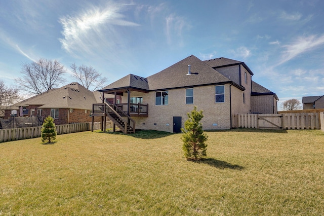 rear view of property with a lawn, a gate, crawl space, a fenced backyard, and stairs