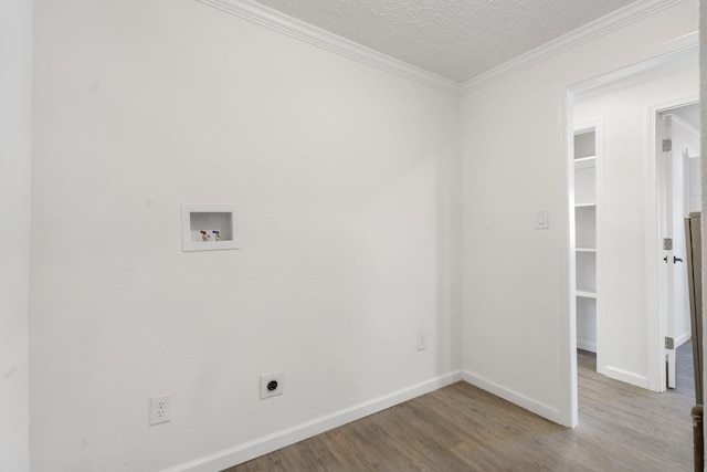 laundry room with laundry area, wood finished floors, crown molding, washer hookup, and electric dryer hookup