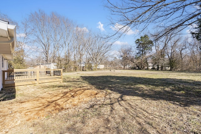 view of yard with a wooden deck