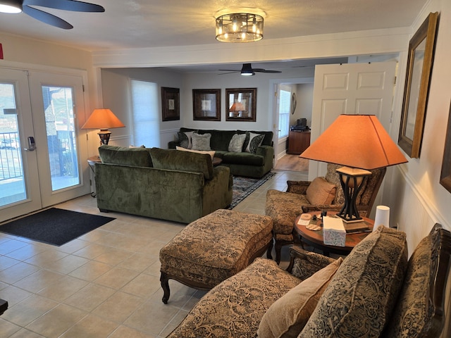 living area featuring a wealth of natural light, french doors, light tile patterned flooring, and ceiling fan