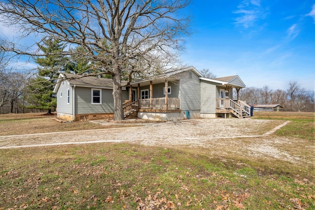 view of front of home with crawl space and covered porch