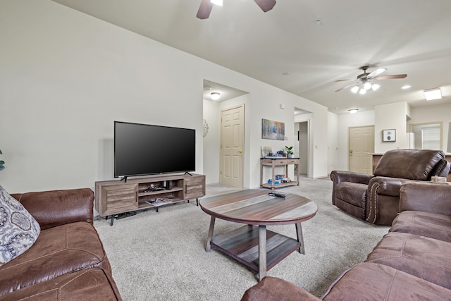 living room featuring ceiling fan and carpet