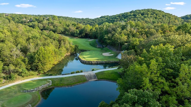 aerial view with a water view, a forest view, and golf course view