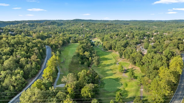 birds eye view of property featuring a view of trees