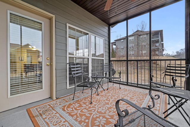 sunroom / solarium with ceiling fan