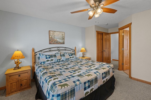 bedroom featuring a ceiling fan, a closet, baseboards, and carpet flooring