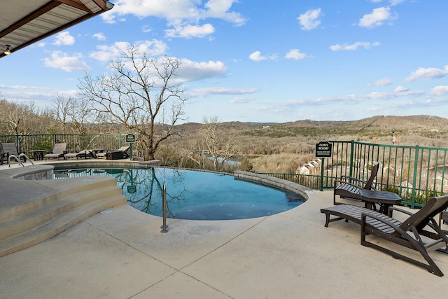 view of swimming pool featuring a patio area and a fenced in pool