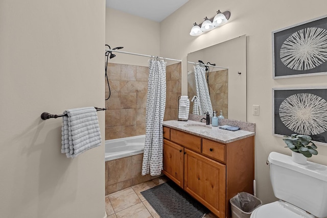 full bath featuring vanity, tiled shower / bath combo, tile patterned flooring, and toilet