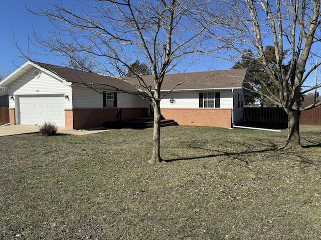 view of front of property with brick siding, an attached garage, fence, and a front yard