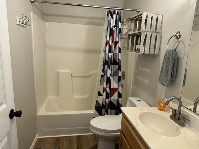 full bathroom featuring shower / bath combo with shower curtain, vanity, toilet, and wood finished floors