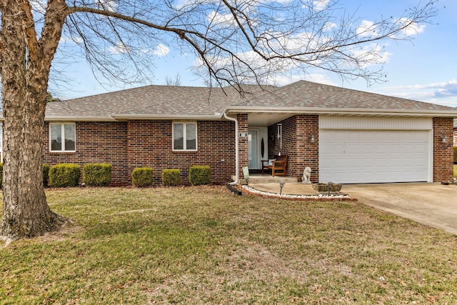 ranch-style home with a garage, concrete driveway, roof with shingles, a front lawn, and brick siding